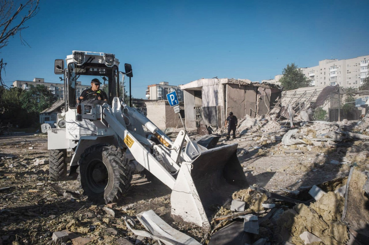 This handout photograph taken and released by Ukrainian Emergency Service on August 8, 2023 shows employees working to clear the rubbles of a partially destroyed residential building and hotel one day after Russian missiles strikes in Pokrovsk, Donetsk region amid Russian invasion of Ukraine. (AFP)