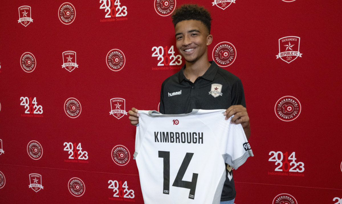 Da'vian Kimbrough, 13, holds up his jersey after signing a contract with the Sacramento Republic of the second-tier League Championship of the United Soccer League, Tuesday in Sacramento, Calif. (AP)