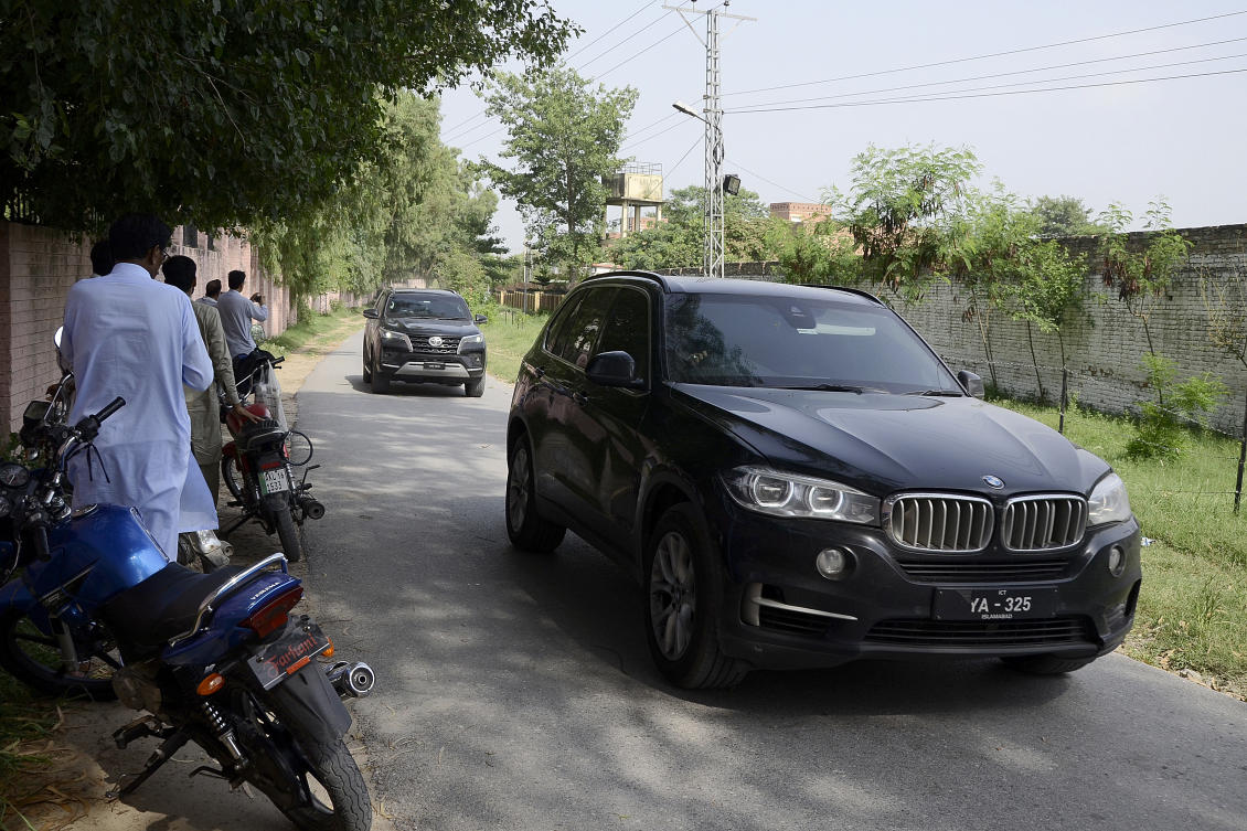 Members of media film a vehicle carrying Bushra Bibi, wife of Pakistan's imprisoned former Prime Minister Imran Khan, driving towards the district prison, in Attock, Pakistan. (AP)
