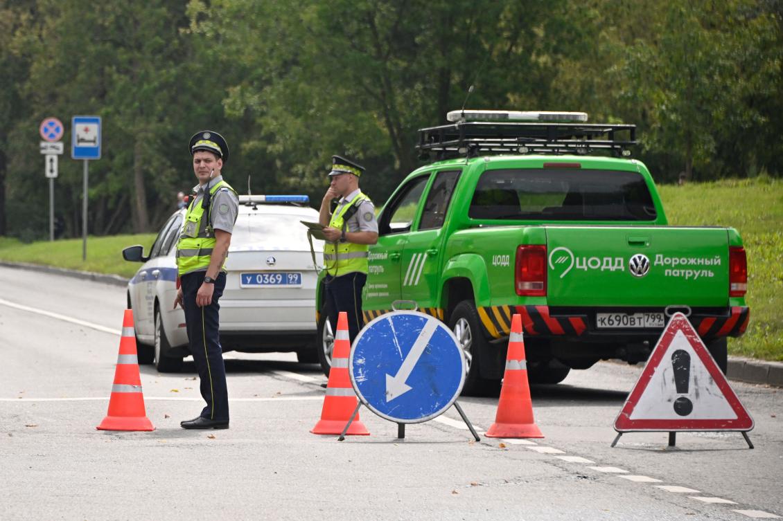 Traffic police block road near the site where Ukrainian drone targeting the Russian capital was downed by air defense system, in western Moscow. (AFP)