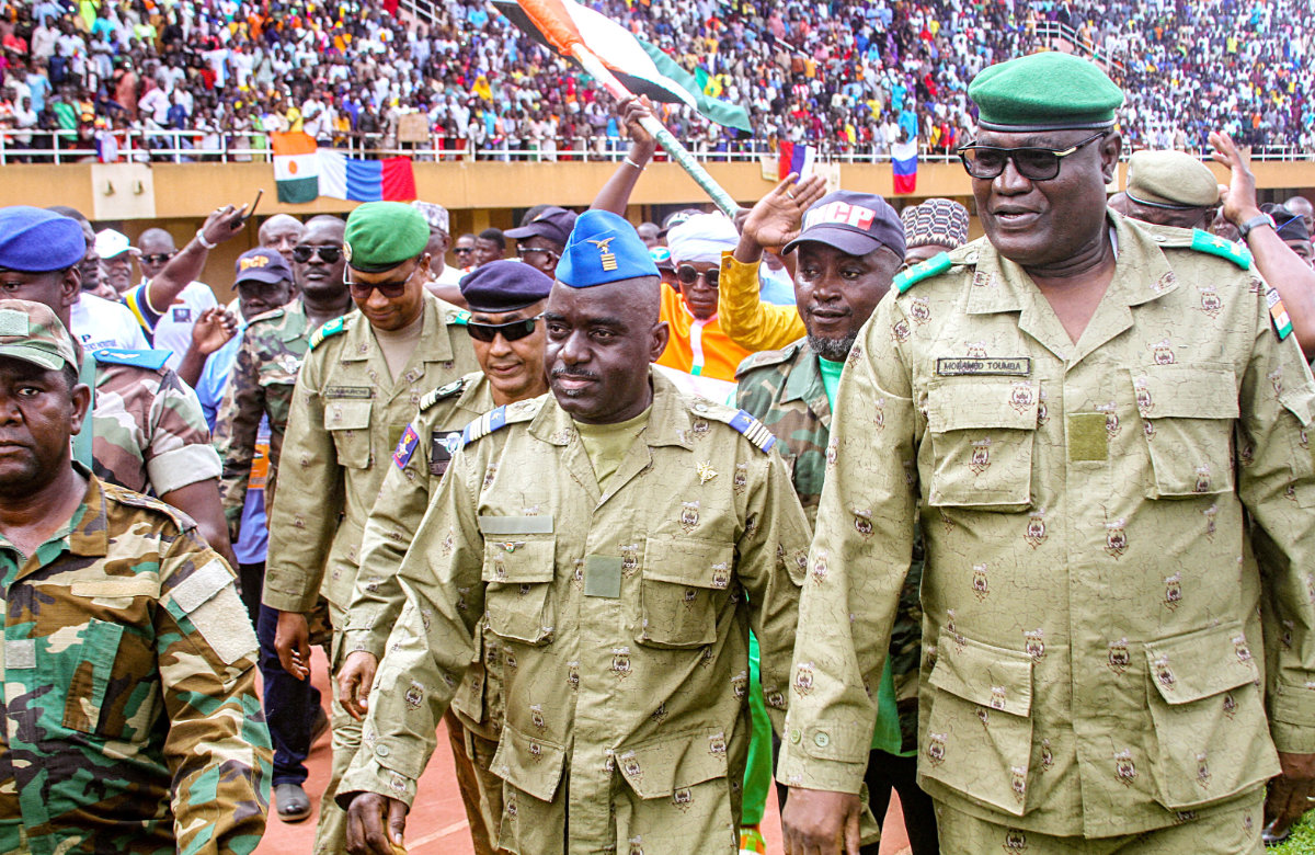 Members of a military council that staged a coup in Niger attend a rally in Niamey. Russia has warned against any foreign military intervention in Niger. (Reuters)
