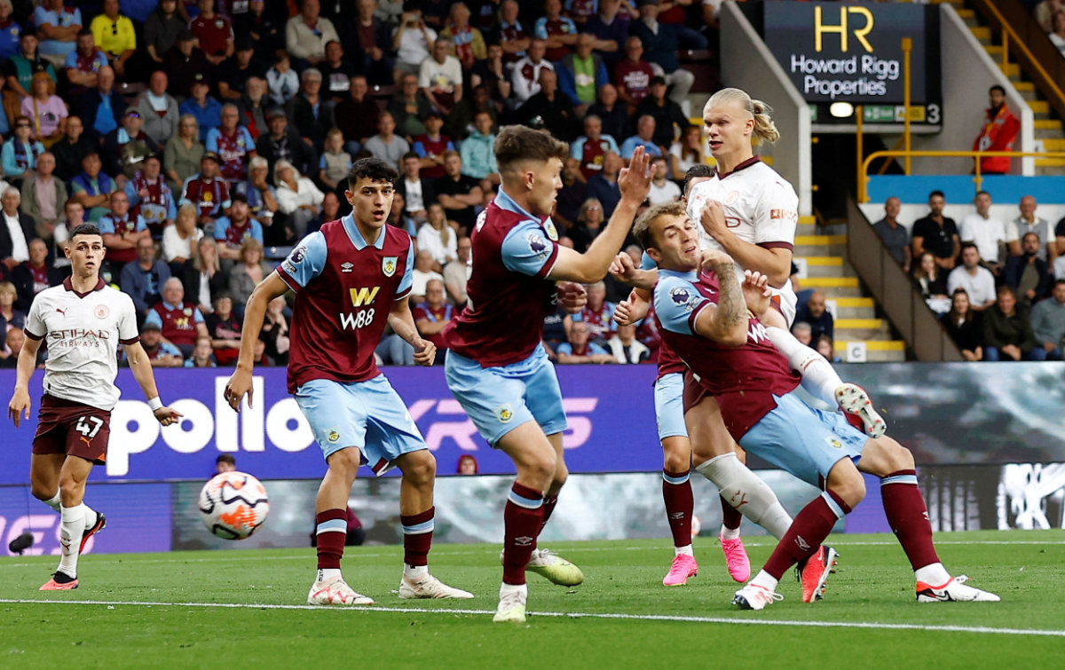 Manchester City's Erling Haaland scores their first goal and the first goal of the new Premier League season against Burnley on Friday. (Reuters)