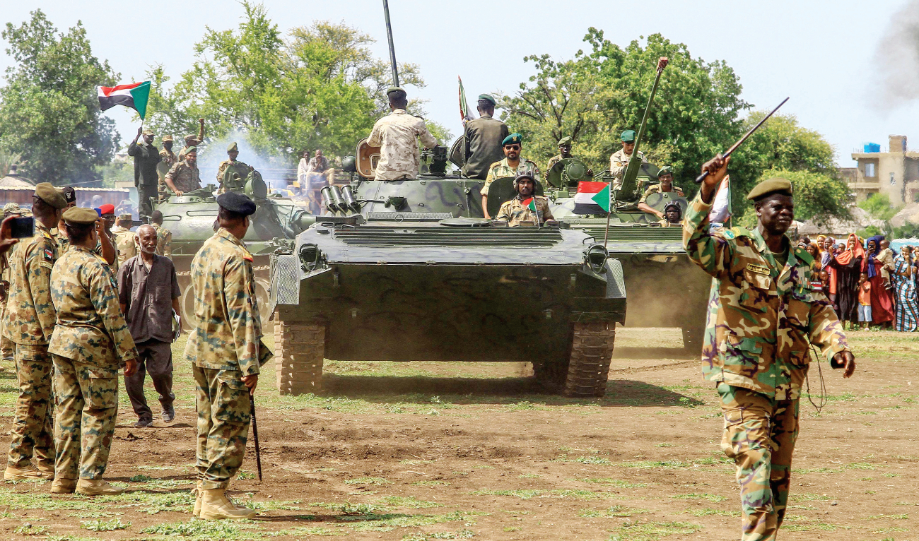 Sudanese security forces mark Army Day in the eastern Gadaref State on Monday. Fighting between the forces of rival generals has killed nearly 3,900 people. (AFP)