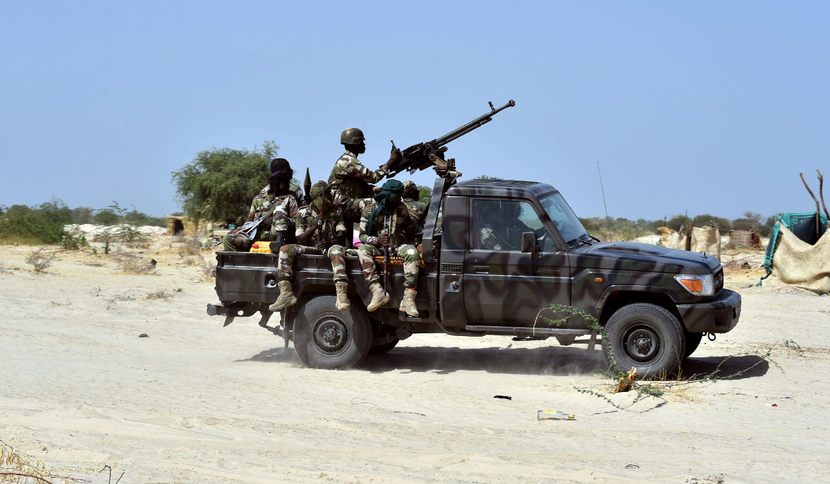 Niger soldiers ride in a military vehicle on May 25, 2015 in Malam Fatori, in northern Nigeria, near the border with Niger, where the Niger and Chadian army troops are working together in support of Nigerian forces, to fight the Boko Haram Islamist group. (AFP)