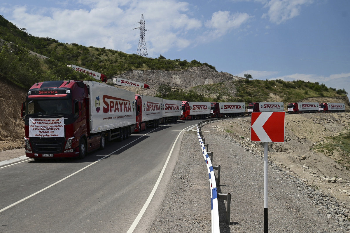 Trucks with humanitarian aid for Artsakh are parked in a road toward the separatist region of Nagorno-Karabakh, in Armenia, on July 28, 2023. (PHOTOLURE via AP, File)