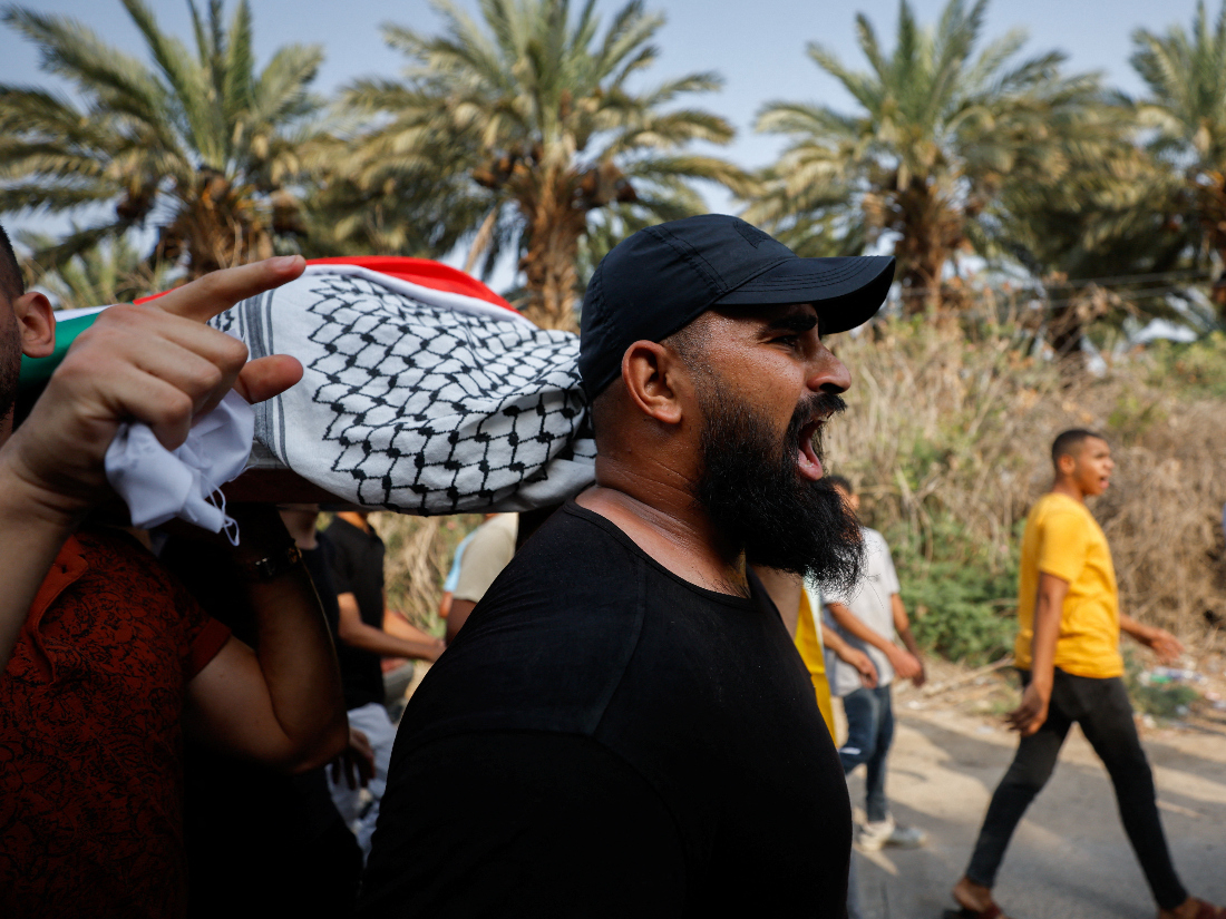 Mourners carry the body of a Palestinian who was killed in an Israeli raid, during his funeral in Jericho, in the Israeli-occupied West Bank. (Reuters)