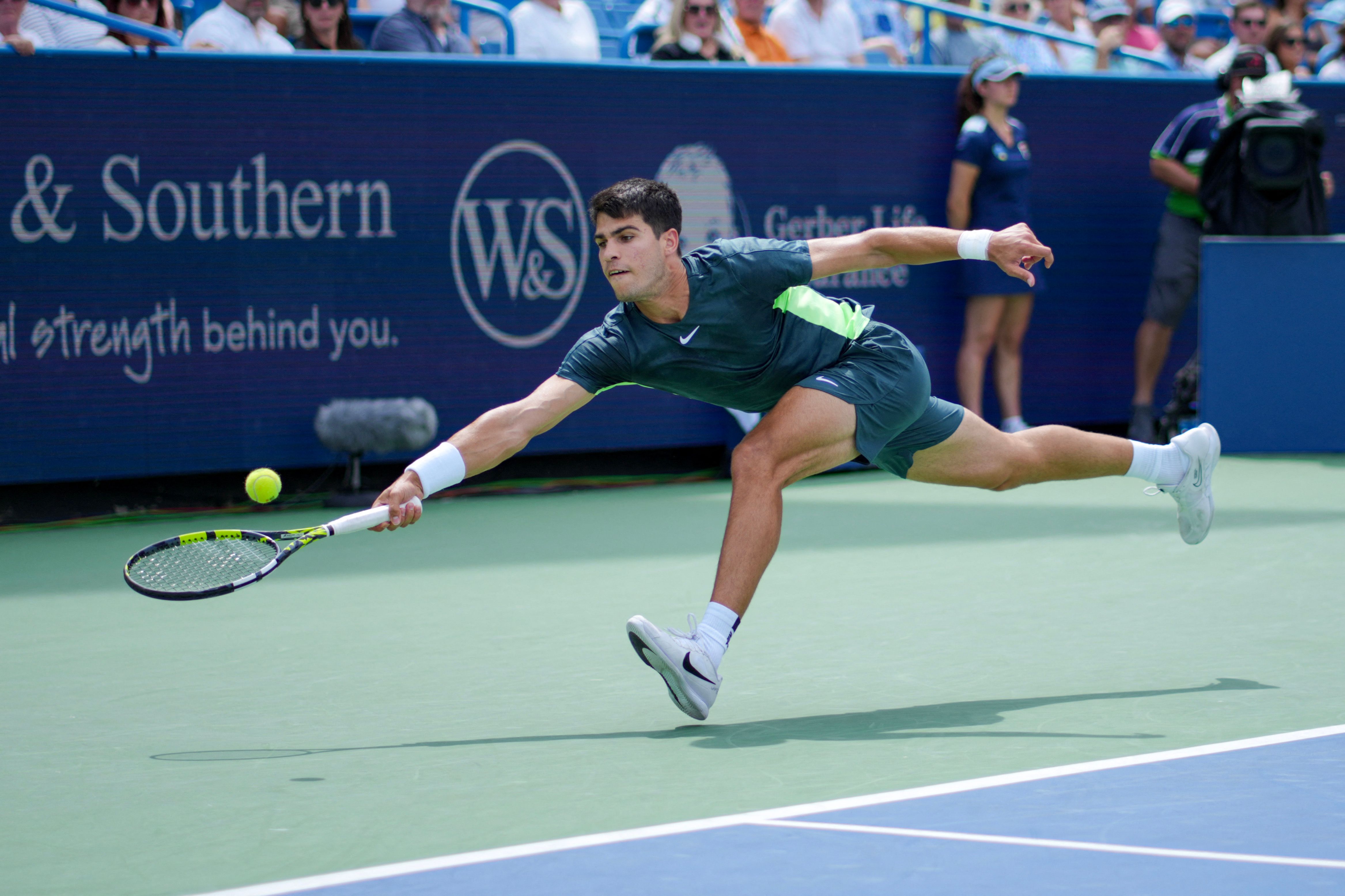Carlos Alcaraz of Spain reaches to return a shot to Tommy Paul of the US during their third round match at the Western & Southern Open at Lindner Family Tennis Center in Mason, Ohio. (File/AFP)