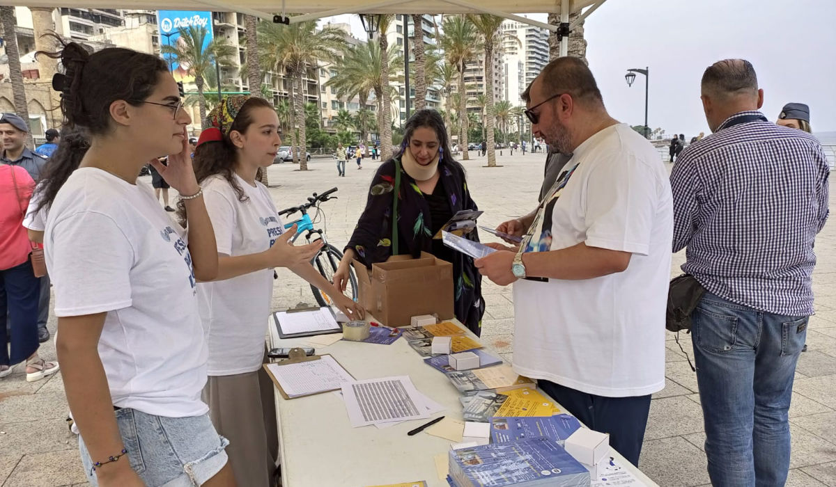 The Becky’s Button Association has set up a tent on the Beirut Corniche to attract women and children, introducing them to the small, lightweight alarm device. (Supplied)