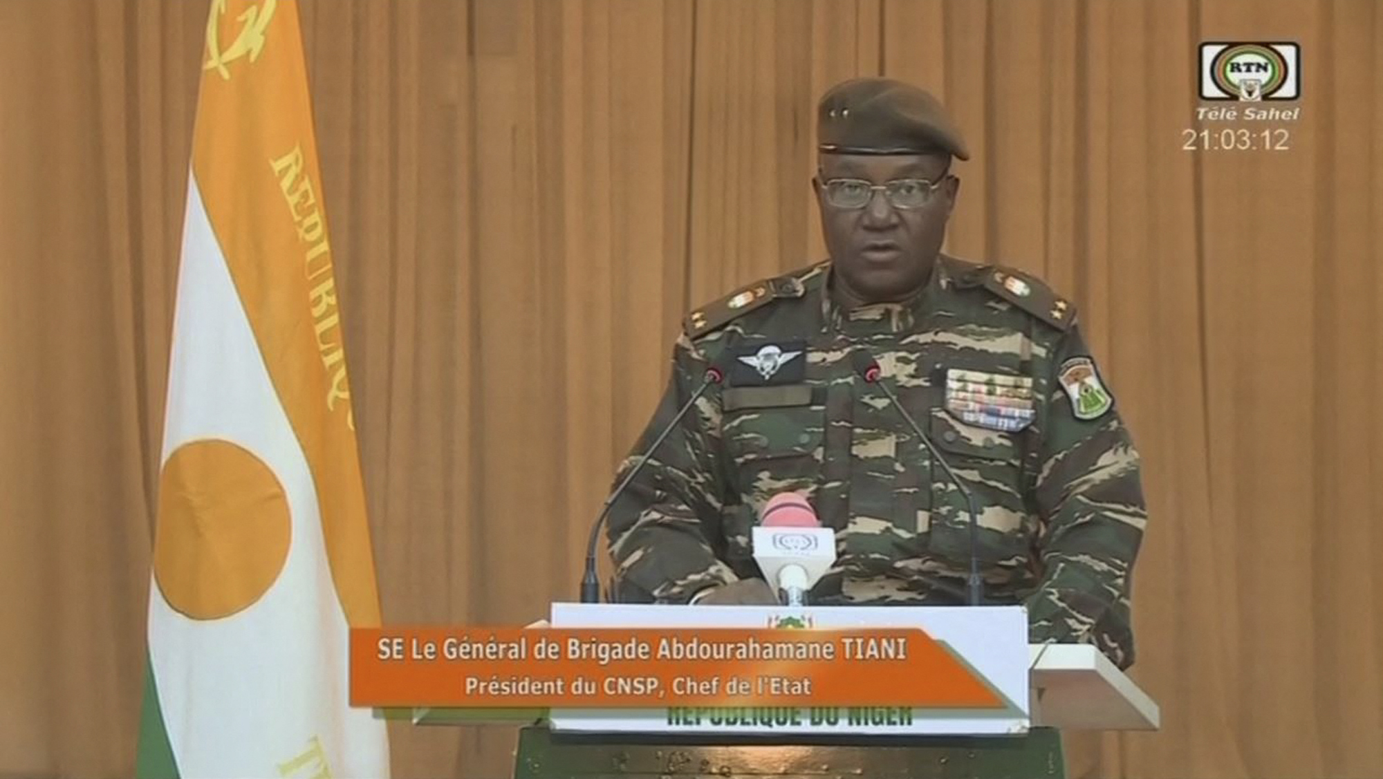 This video frame grab image obtained by AFP from ORTN - Télé Sahel on August 19, 2023 shows Niger's new military ruler General Abdourahamane Tiani, reading a statement on national television. (AFP/ORTN - Télé Sahel)