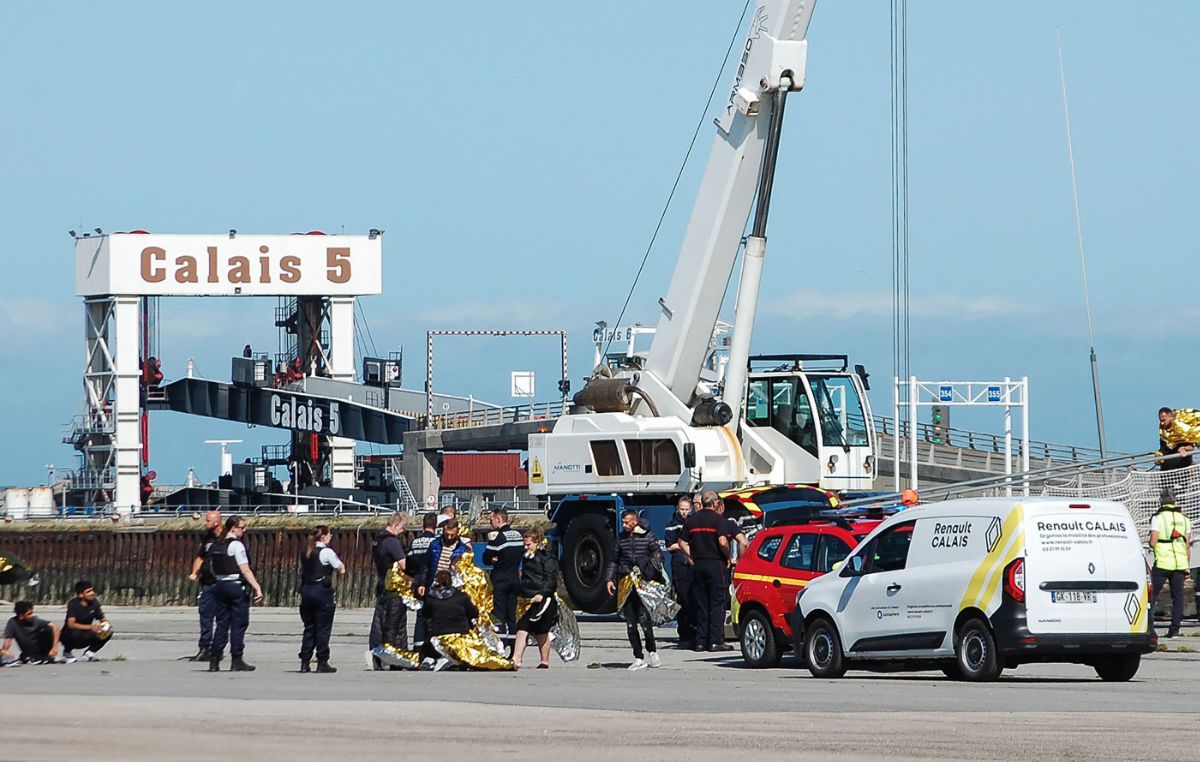 Migrants disembark from the National navy public service patrol boat "Le Pluvier" on the docks of the port of Calais, northern France, on August 19, 2023. (AFP)