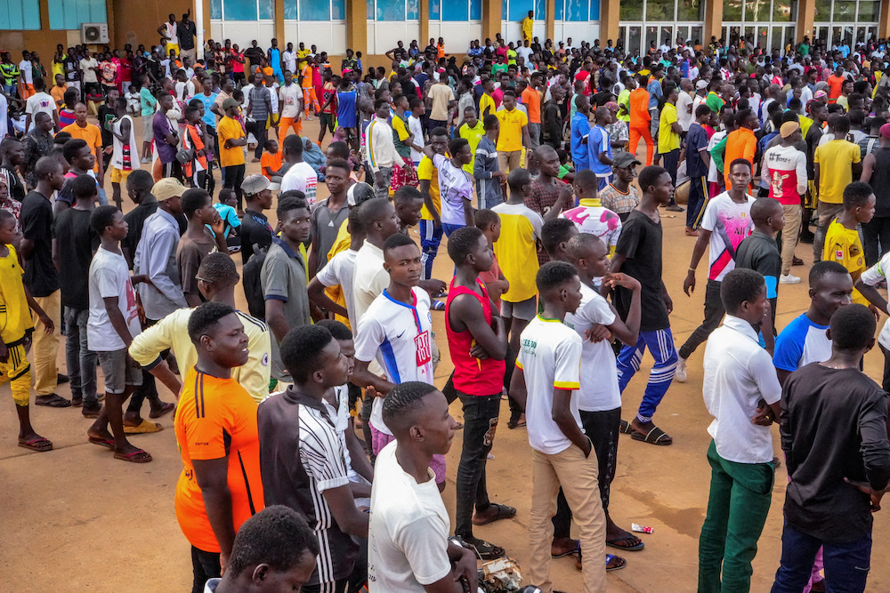Thousands of young Nigeriens gather as they heed call to sign up as non-military volunteers to back up the junta in the capital Niamey. (Reuters)