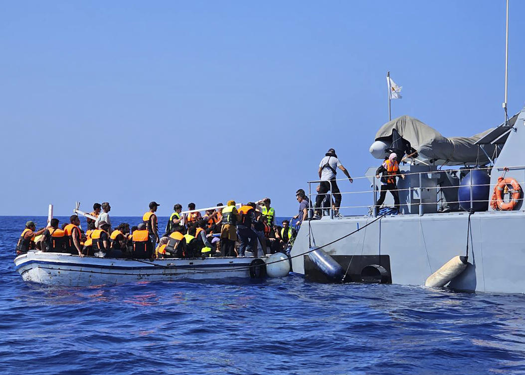 This image provided from Cyprus' Joint rescue Coordination Center shows Cyprus' rescue team helping migrants from a boat in the sea near the eastern coastal resort of Protaras, on the east side of the Mediterranean island of Cyprus, on Sunday, Aug. 21, 2023. (AP)