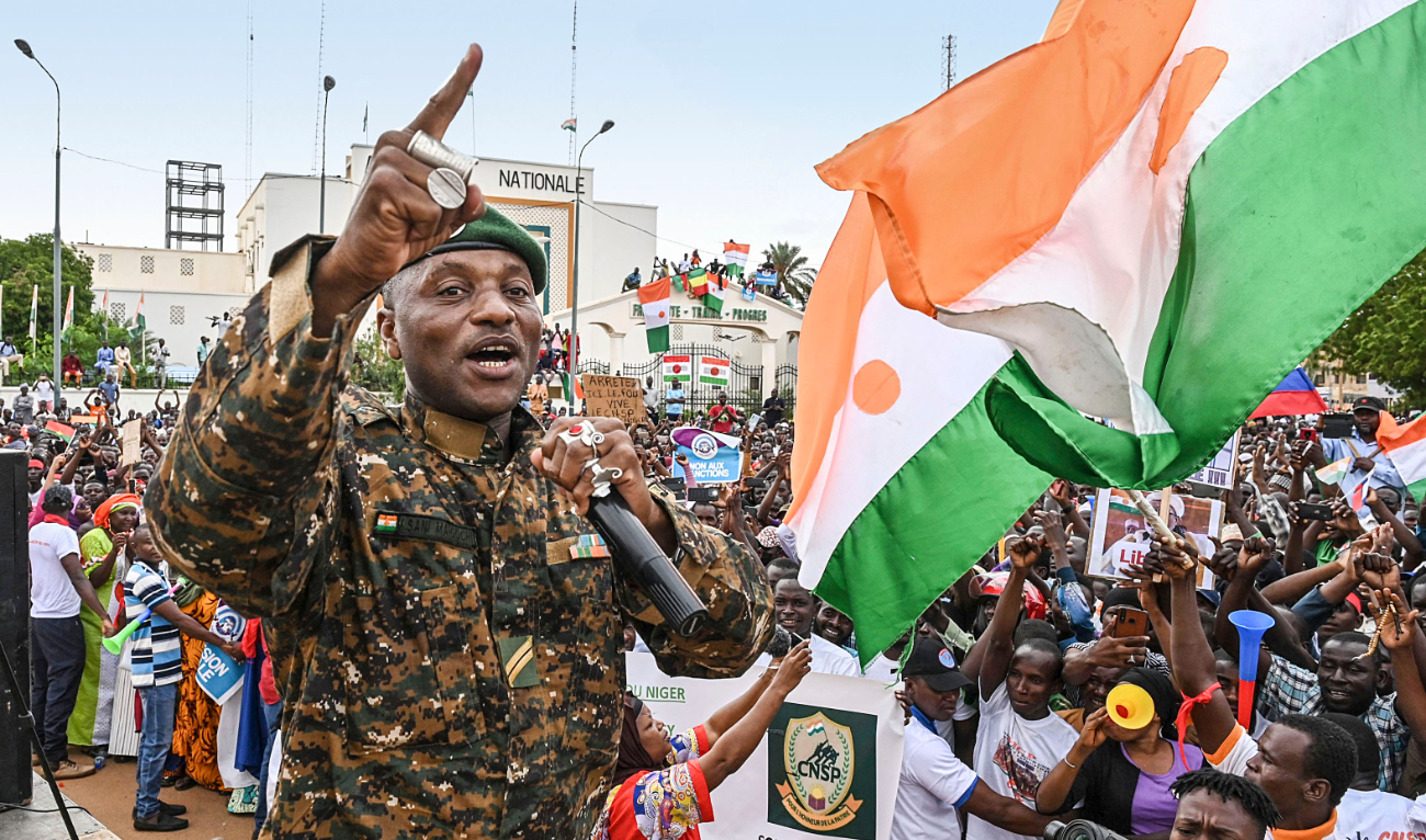 A Niger army sergeant performs as supporters of the National Council of Sefeguard of the Homeland gather at Place de la Concertation in Niamey. (AFP)