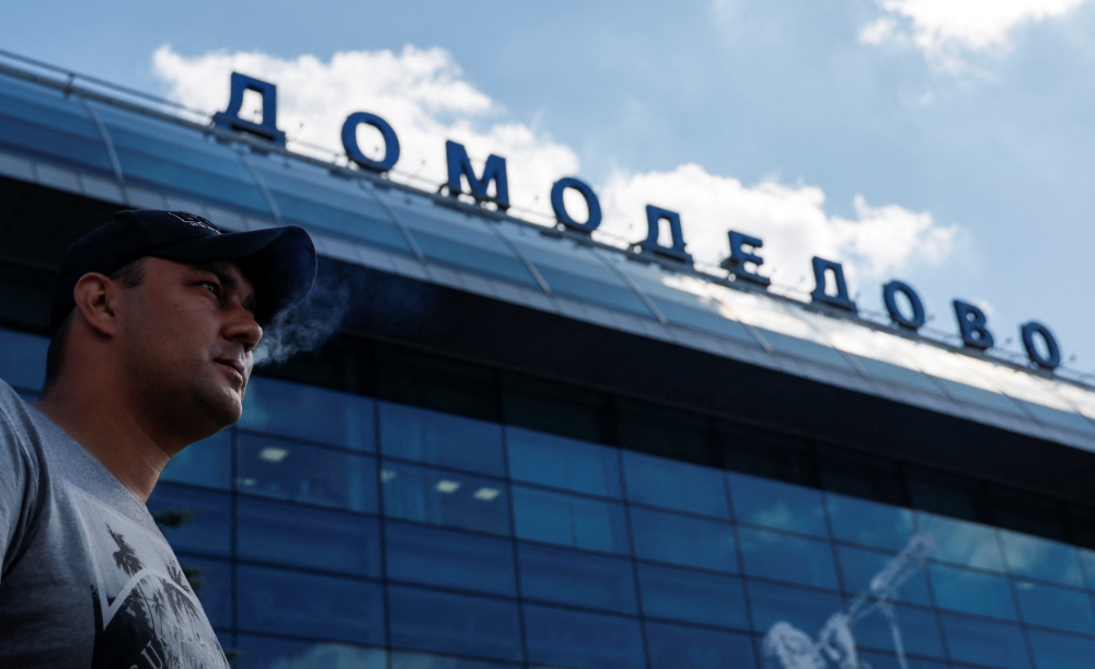 A man smokes at the Domodedovo airport outside Moscow, Russia. (Reuters)