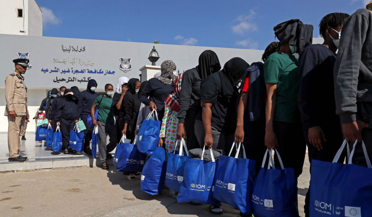 Nigerian migrants who voluntarily chose to return to their home country board a bus before flying out of Libya, during an operation organised by the the International Organisation for Migration (IOM) in Tripoli on August 21, 2023. (AFP)