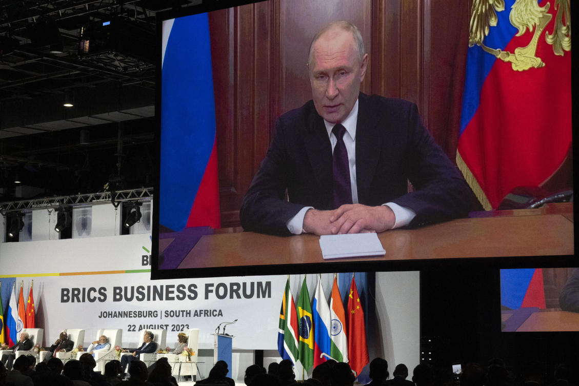 Russian President Vladimir Putin addresses leaders from the BRICS group of emerging economies at the start of a three-day summit in Johannesburg, South Africa (AP)