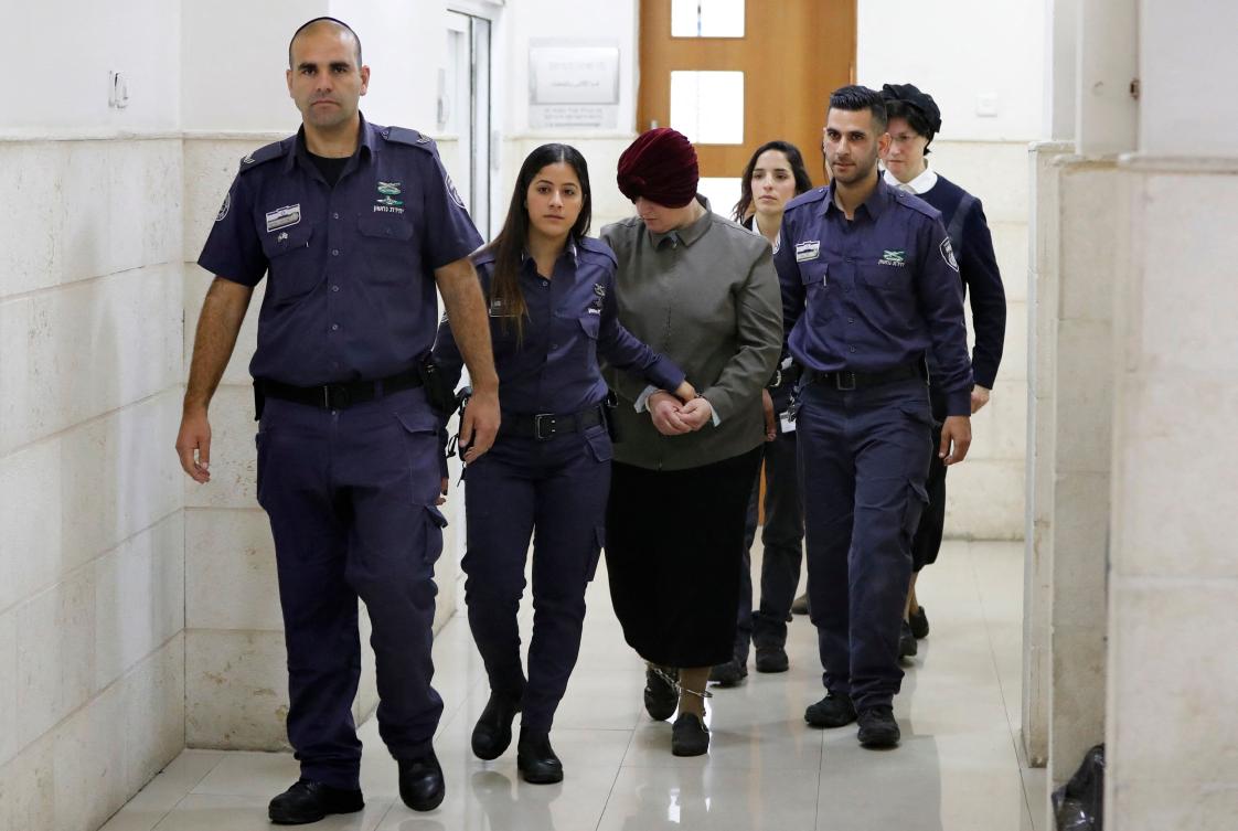 Malka Leifer, center, who also holds Israeli citizenship, was extradited to Australia from Israel in 2021 after fleeing in 2008 when the accusations surfaced. (AFP)