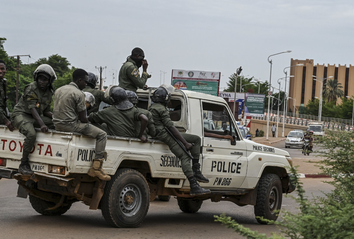 Nigerien police patrol along the streets of the capital, Niamey, on August 21, 2023. Tensions have been escalating in Niger as the West African bloc ECOWAS and the African Union put pressure on the military junta to restore the elected president that they ousted last month. (Photo by AFP)