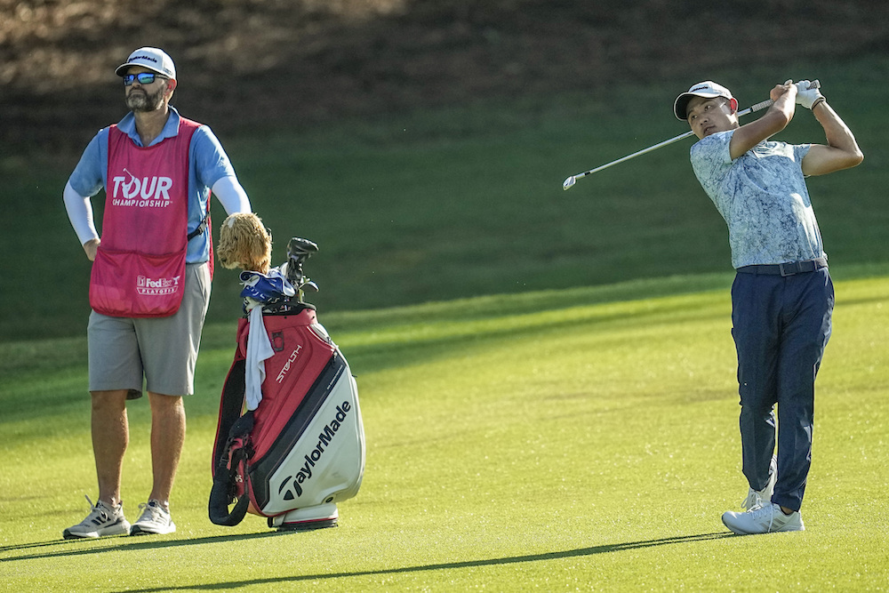 Collin Morikawa hits from the 18th fairway during the second round of the Tour Championship golf tournament Friday in Atlanta. (AP)