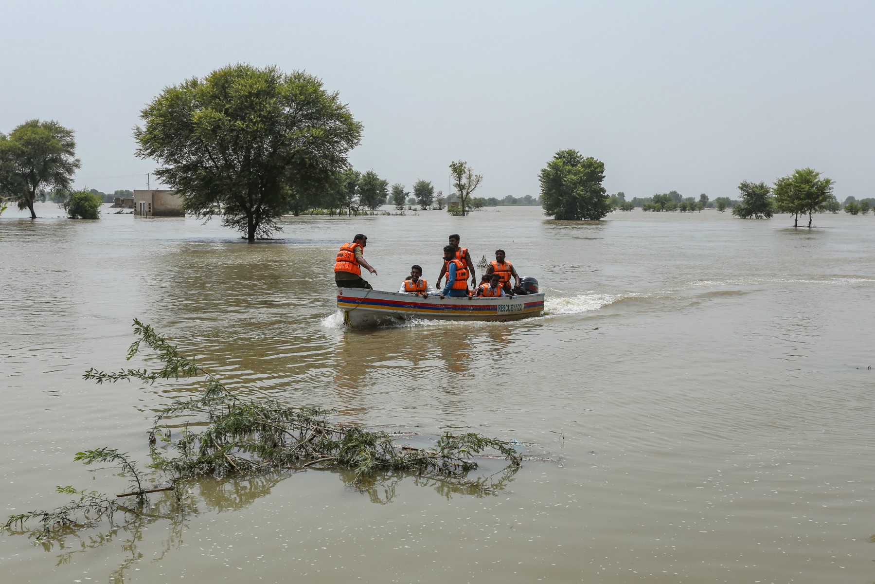 Rescuers evacuate flood affected people from a flooded area of Burewala, a town of southern Punjab province (AFP)