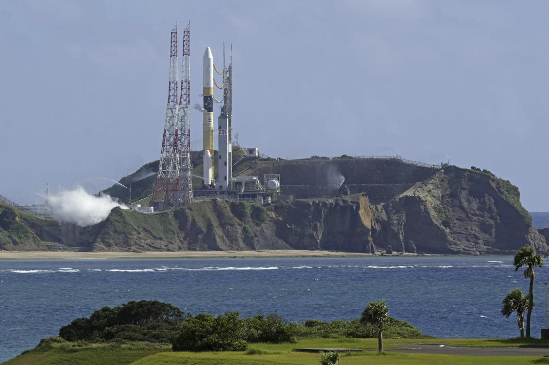 An H2A rocket sits at launch pad at Tanegashima Space Center in Kagoshima, southern Japan on Aug. 28, 2023. The rocket was to blast off Monday morning, but the lift-off was postponed due to strong winds. (Kyodo News via AP)