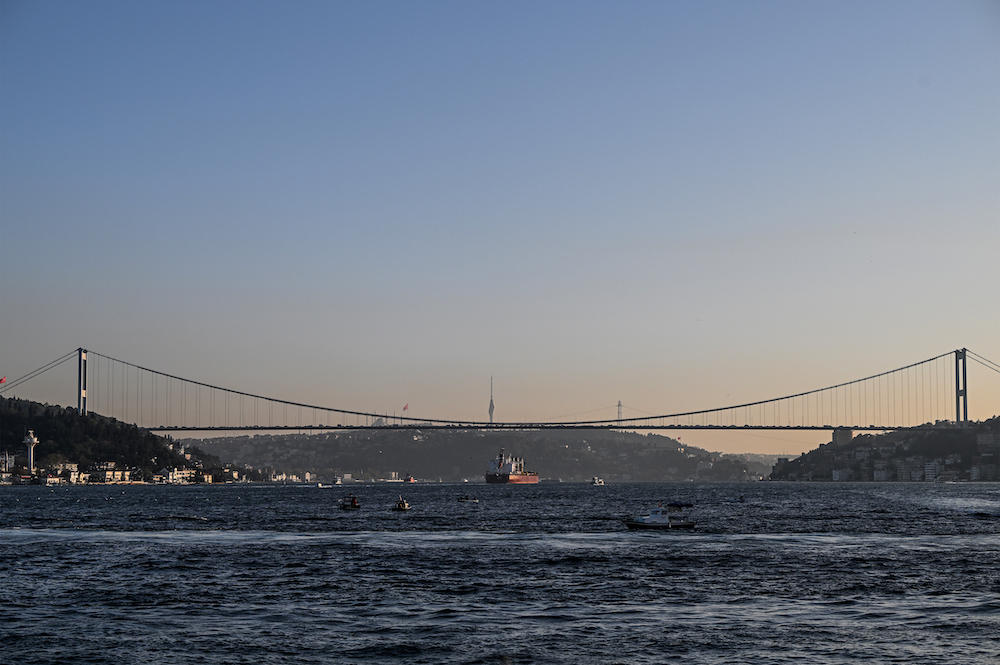 Turkiye is trying to persuade Russia to return to a deal that allows for the export of grain via Ukraine’s Black Sea ports. Above, a cargo vessel carrying Ukrainian grain sails under Fatih Sultan Mehmet bridge to Marmara sea, in Istanbul. (AFP)