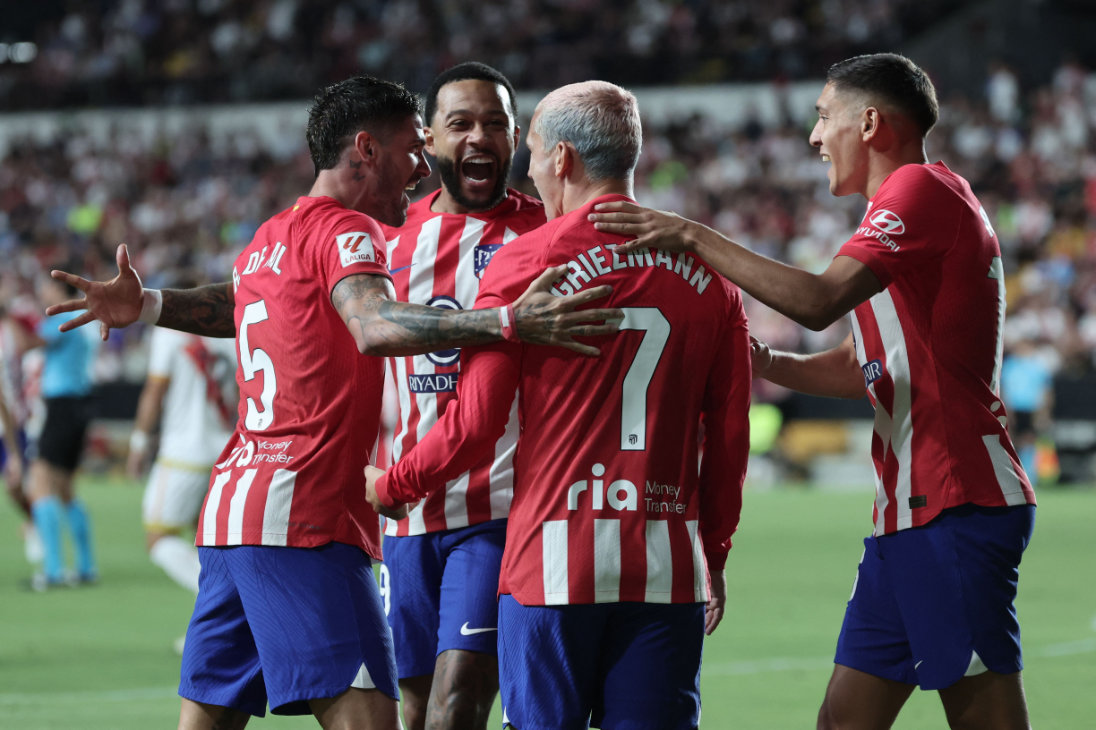 Atletico Madrid's French forward #07 Antoine Griezmann celebrates scoring his team's first goal during the Spanish Liga football match between Rayo Vallecano de Madrid and Club Atletico de Madrid at the Vallecas stadium in Madrid on August 28, 2023. (AFP)