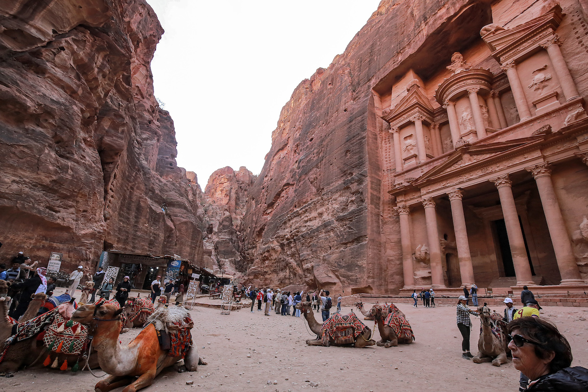 Camels sit awaiting tourists outside the site of the Treasury at the ruins of Petra. (File/AFP)