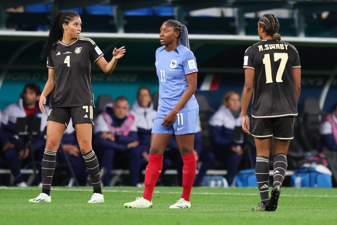 Jamaica's Chantelle Swaby, left, and her sister Allyson, right, react on the field during the Women's World Cup soccer match against France at Sydney Football Stadium in Sydney. The sisters have played together for the Reggae Girlz for the last four years. (AP)