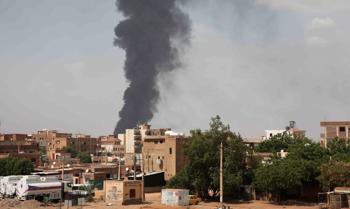 Smoke rises over Khartoum, Sudan, on June 8, 2023, as fighting between the Sudanese army and paramilitary Rapid Support Forces continues. A leading human rights group said on Thursday Aug. 3, 2023 Sudan's warring parties have committed an extensive war crime including mass killings of civilians, rape and sexual slavery of women in the ongoing conflict. (AP)