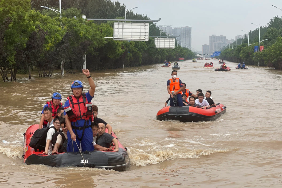 Residents are evacuated by rubber boats through flood waters in Zhuozhou in northern China's Hebei province on Aug. 2, 2023. (AP)
