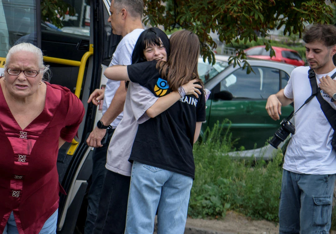Ilona Pavliuk, 16, reacts as she arrives in Kyiv from non-government controlled territories via the Ukraine-Belarus border in Kyiv, on Aug. 2, 2023. (Reuters)
