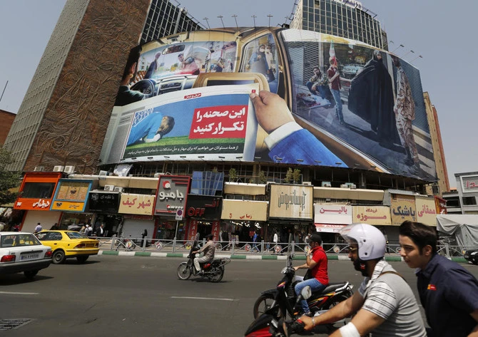 A wildfire on the outskirts of Tehran triggered on Friday an explosion of mines that had been planted around a high-security prison that houses political prisoners. (AFP/File)