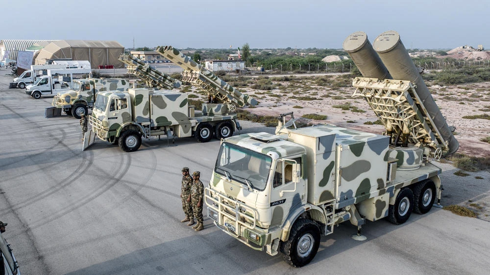 Above, the Iranian Revolutionary Guard display military equipment during an earlier drill on Abu Musa Island in the Arabian Gulf. (Sepahnews via AP)
