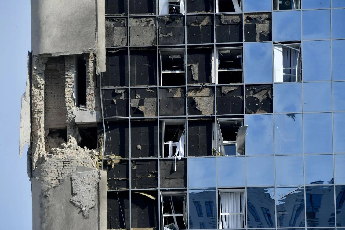 The damage on an administrative building is seen after an overnight drone attack in Kyiv, on Aug. 2, 2023. (AFP)