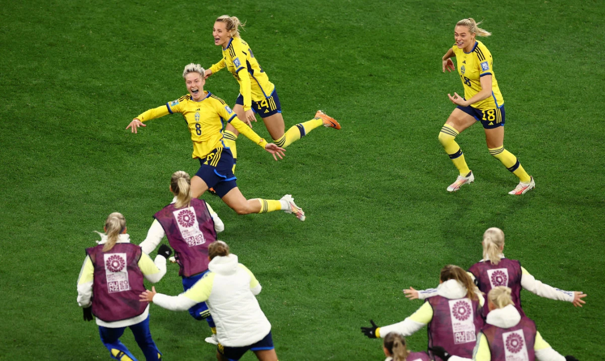 Sweden's Lina Hurtig celebrates with teammates after scoring the winning penalty of the shootout and progressing to the quarterfinals of the Women's World Cup. (Reuters)