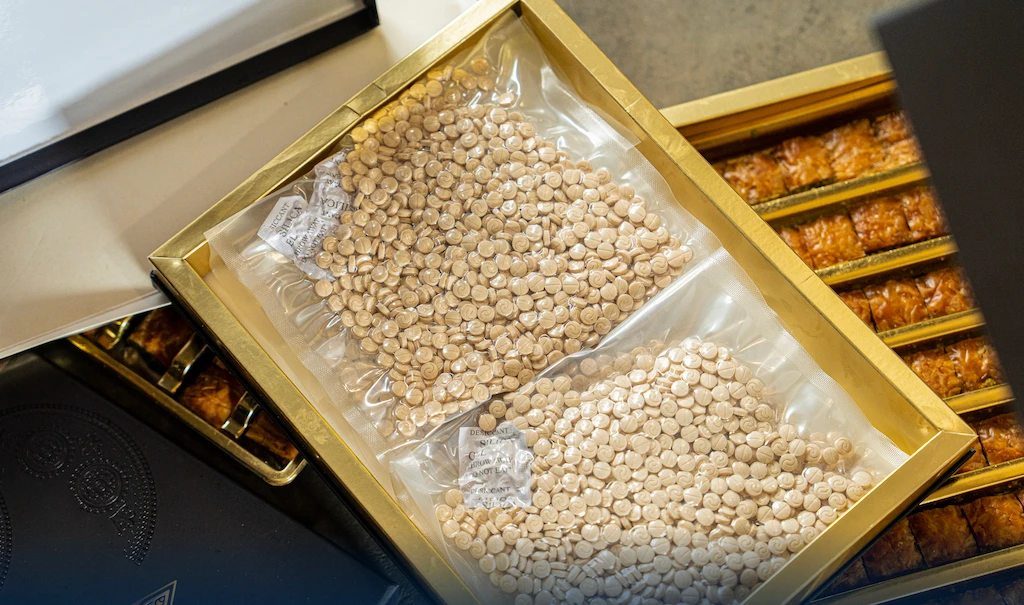 The drugs were discovered hidden under trays of the sweet Baklava pastry. (Zakat, Tax and Customs Authority)