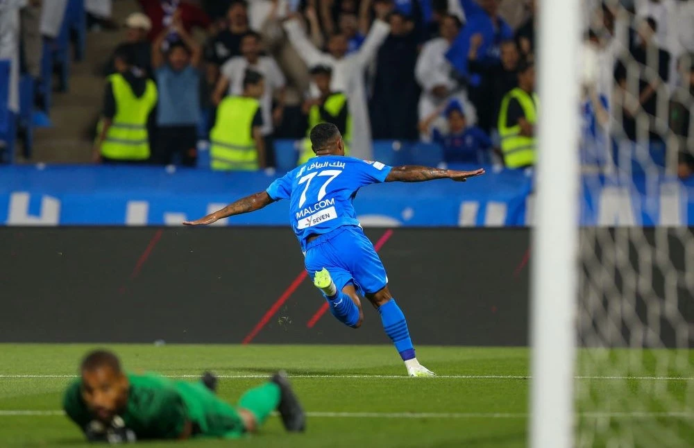 Hilal’s Brazilian forward Malcom celebrates scoring during the Saudi Pro League match between Abha and Al-Hilal at the Prince Sultan bin Abdul Aziz Stadium in Abha, Aug. 14, 2023. (AFP)