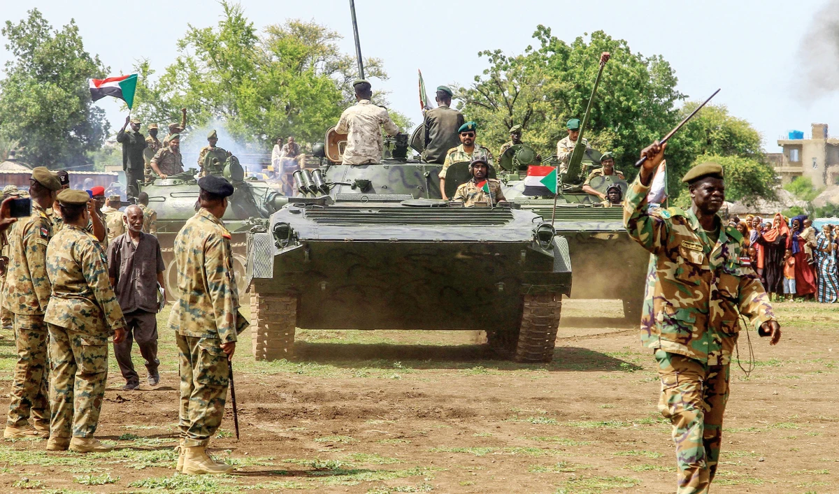 Sudanese security forces mark Army Day in the eastern Gadaref State on Monday. Fighting between the forces of rival generals has killed nearly 3,900 people. (AFP)