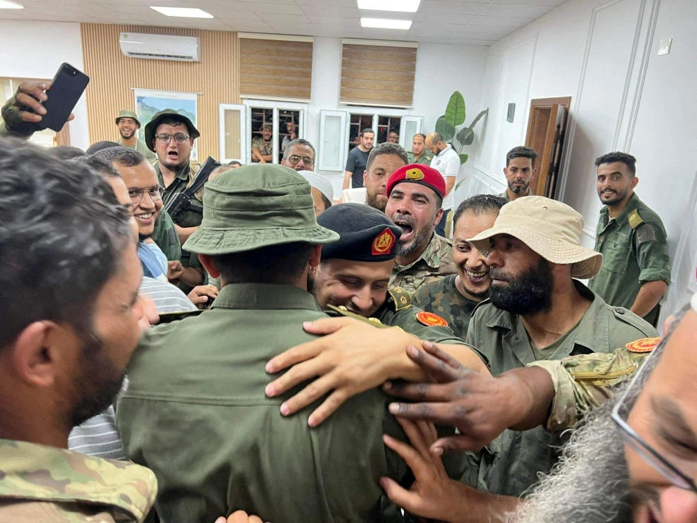 Members of the 444th Brigade receive commander Mahmoud Hamza, who was detained as he attempted to travel from Mitiga airport causing clashes between armed factions, in Tripoli. (Reuters)