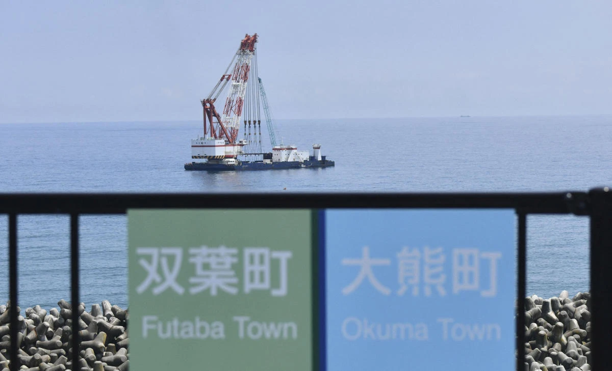 Crane ship seen near discharge outlet meant to release Advanced Liquid Processing System (ALPS) treated water into the sea off the tsunami-crippled Fukushima Daiichi nuclear power plant in Okuma town. (File/Reuters)