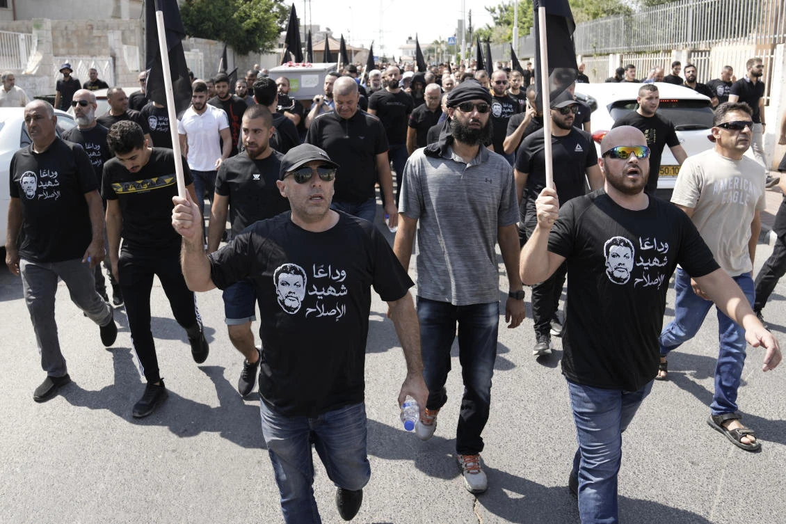 Mourners march in the funeral procession for Abed Al-Rahman Kashua, the Director-general of the Municipality in Tira, Israel, on Aug. 23, 2023. (AP)
