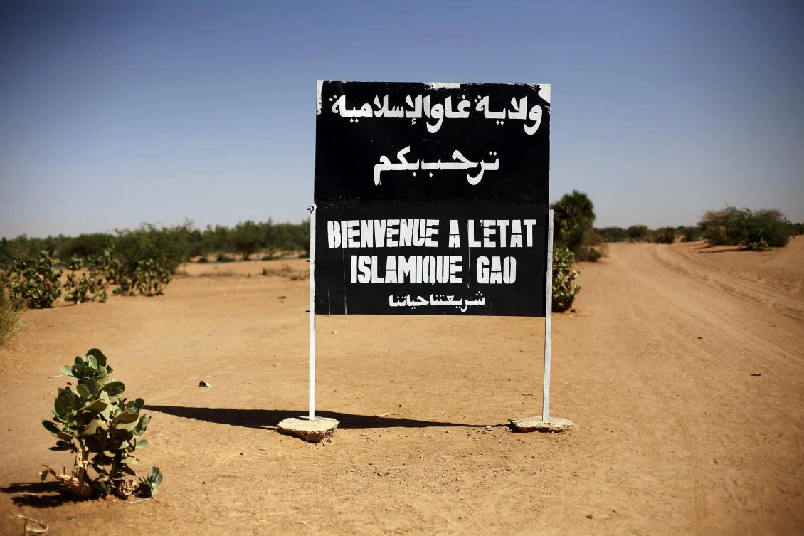 Above, a road sign in Gao, Northern Mali reads “Welcome to the Islamic state of Gao” on Jan. 30, 2013. Daesh extremists have almost doubled the territory they control in Mali in less a year. (AP)
