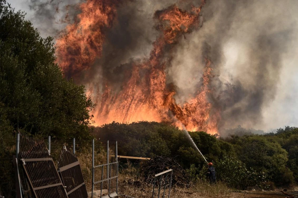 A Greek firefighter battles a forest fire spreading in Dikella near Alexandroupoli, northern Greece, on August 23, 2023. (AFP)
