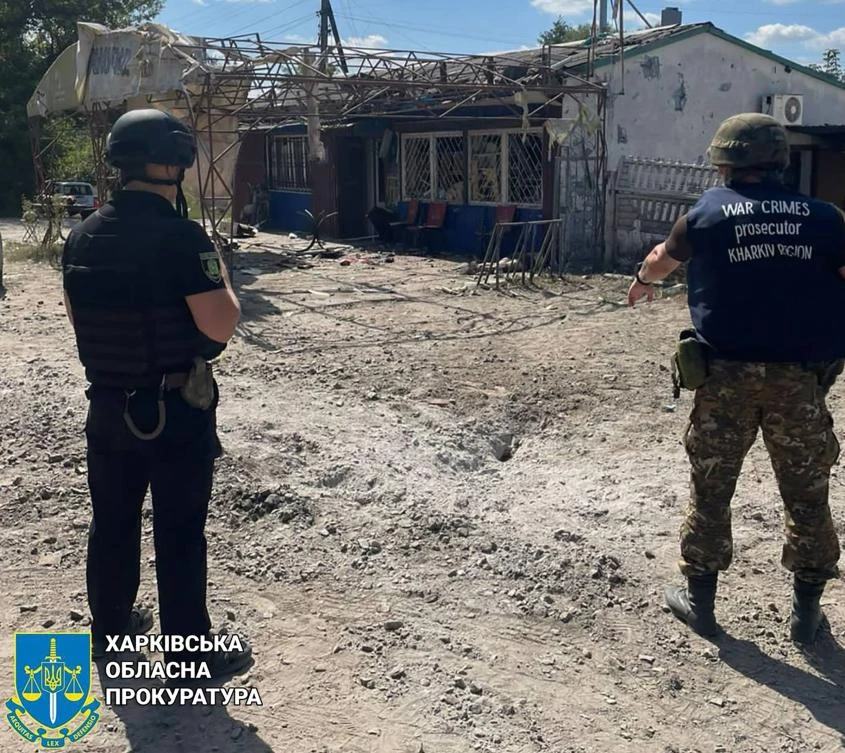 In this handout photograph taken and released by the Office of the Prosecutor General of Ukraine on August 26, 2023, war crime prosecutors work at the site of a shelling in the village of Podoly near Kupiansk, Kharkiv region. (AFP)