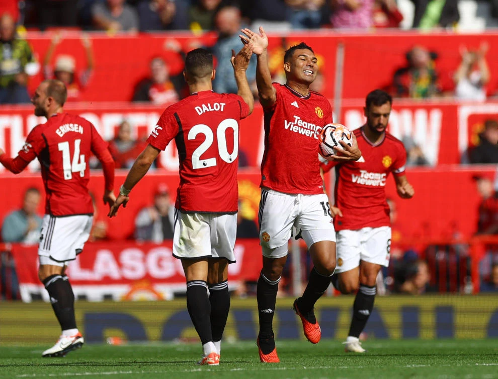 Manchester United’s Casemiro celebrates scoring their second goal with Diogo Dalot during their Premier League match against Nottingham Forest, at Old Trafford, Manchester on August 26, 2023. (Reuters)
