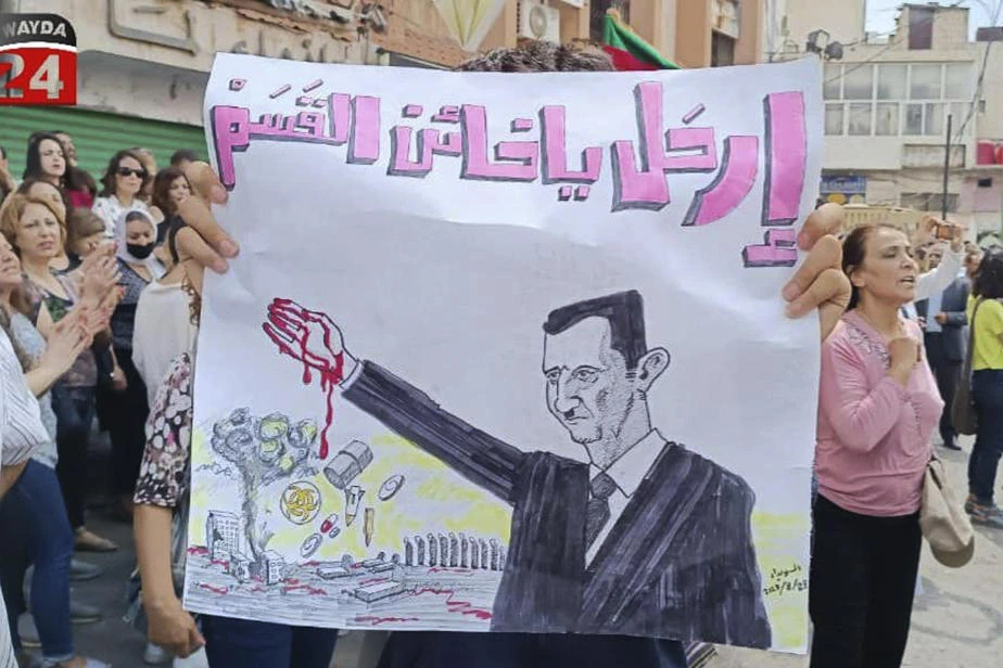 Angry protesters raided the local offices of the ruling Baath party in a south Syrian province as protests intensified against the country’s government during a severe economic and financial crisis battering the war-torn country. (Suwayda24 via AP)