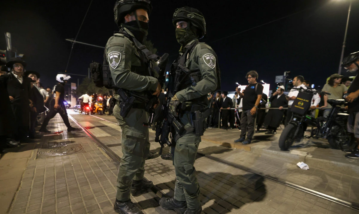 Israeli emergency and security personnel deploy at the site of a reported attack in Jerusalem on August 30, 2023. (AFP)