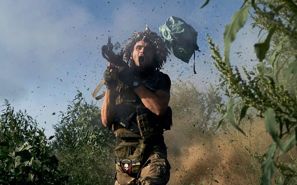A Ukrainian 53rd brigade serviceman fires an RPG-9 towards Russian positions. (AP)