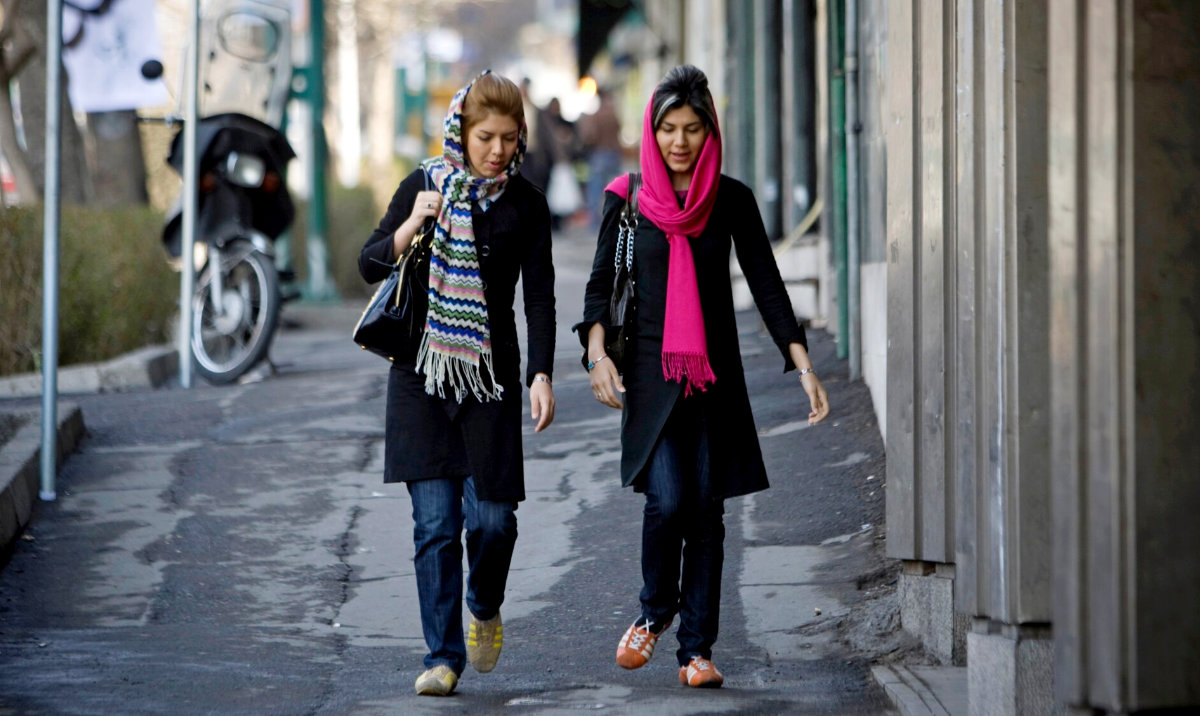 Iranian women walk along a street in Tehran. (Reuters/File)